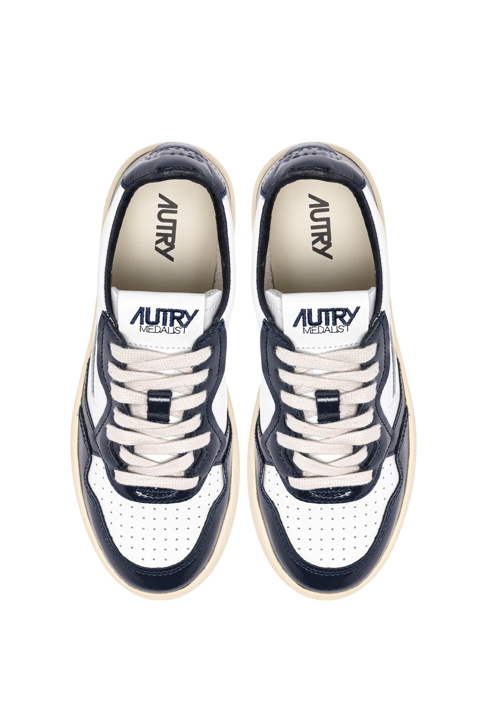 Sneaker donna bimateriale in pelle e vernice AULW RT06 WHT/NIGHT Autry