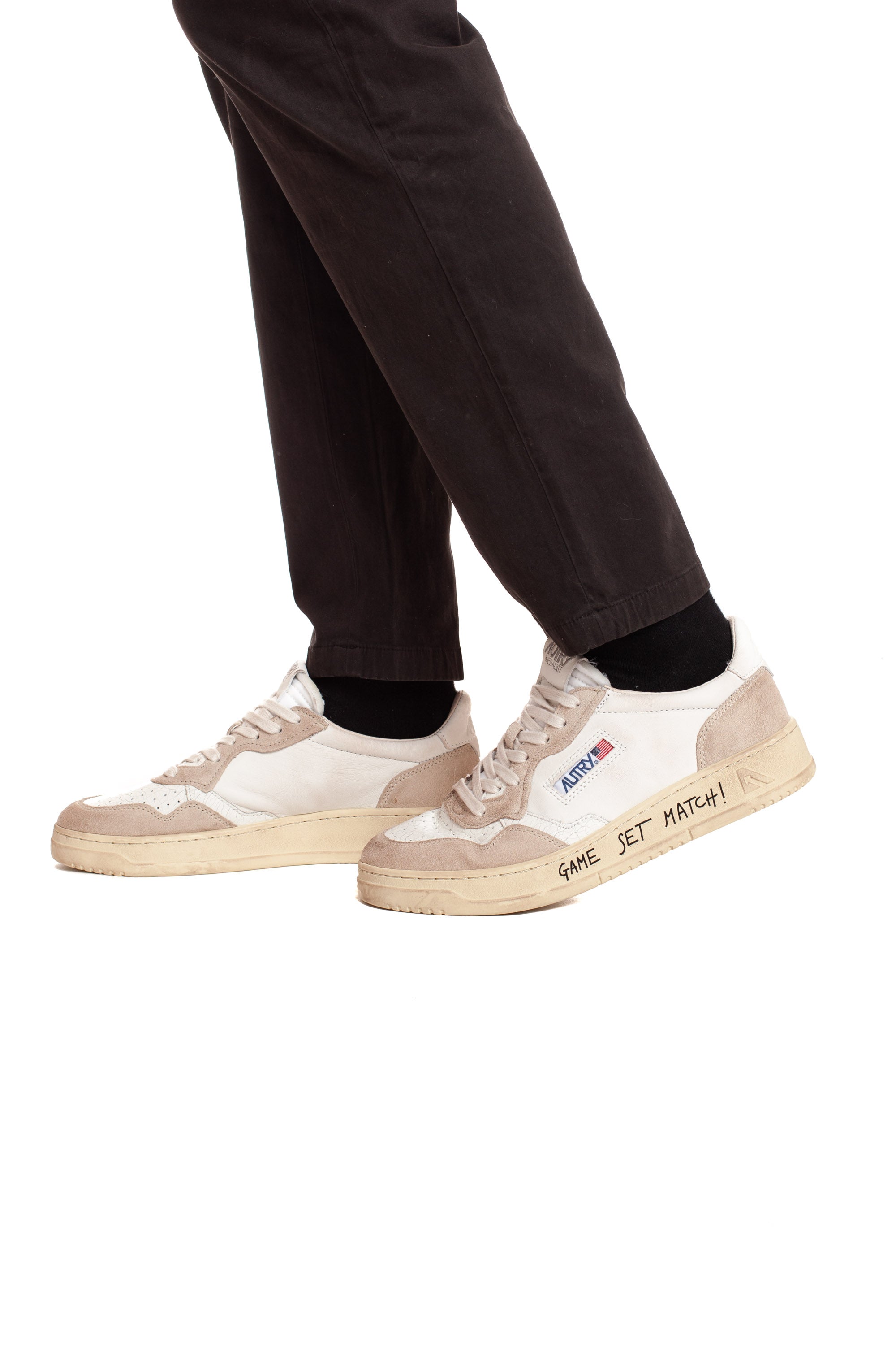 Medalist sneaker with white heel tab and writing