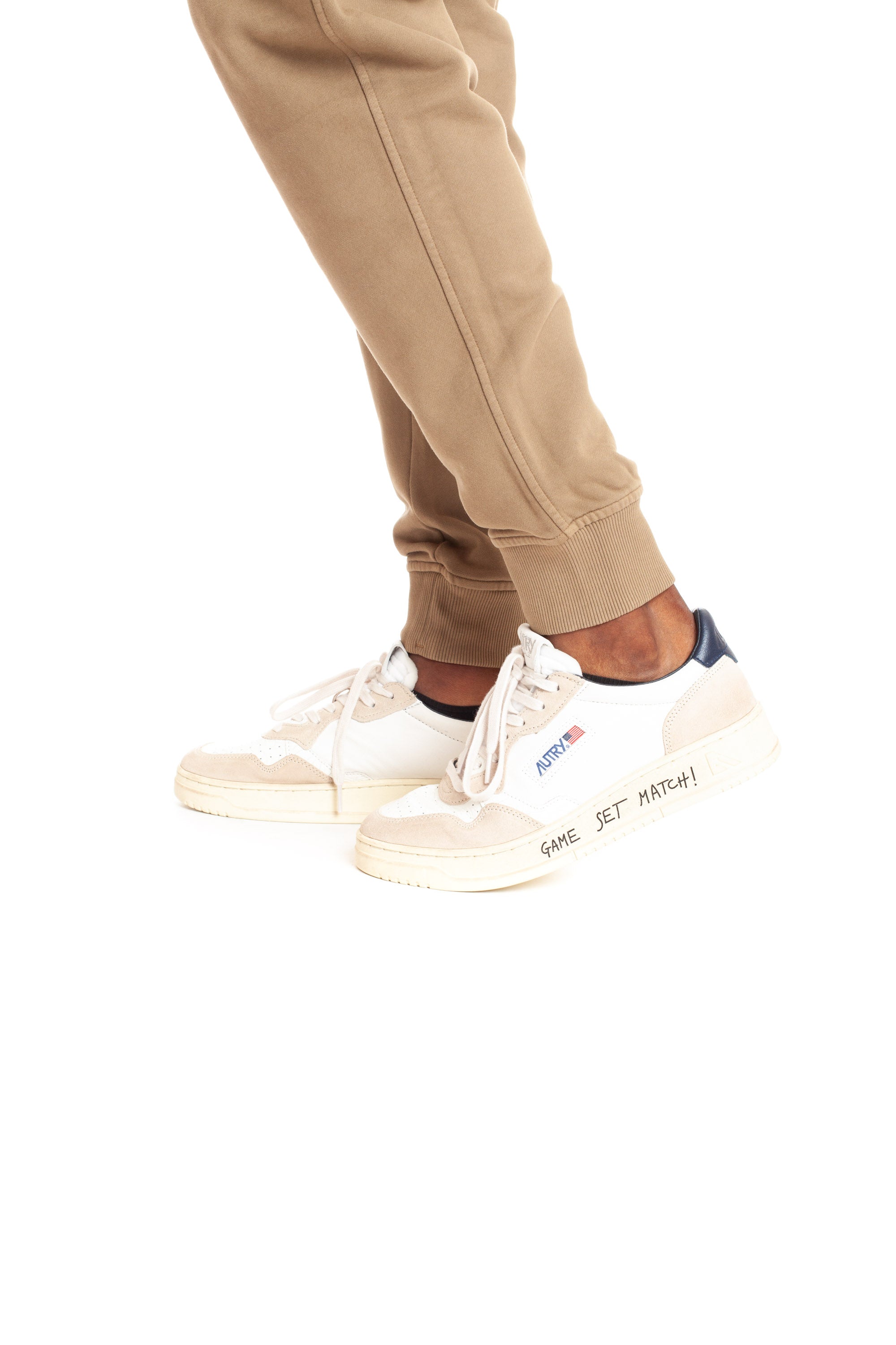 Medalist sneaker with blue heel tab and writing