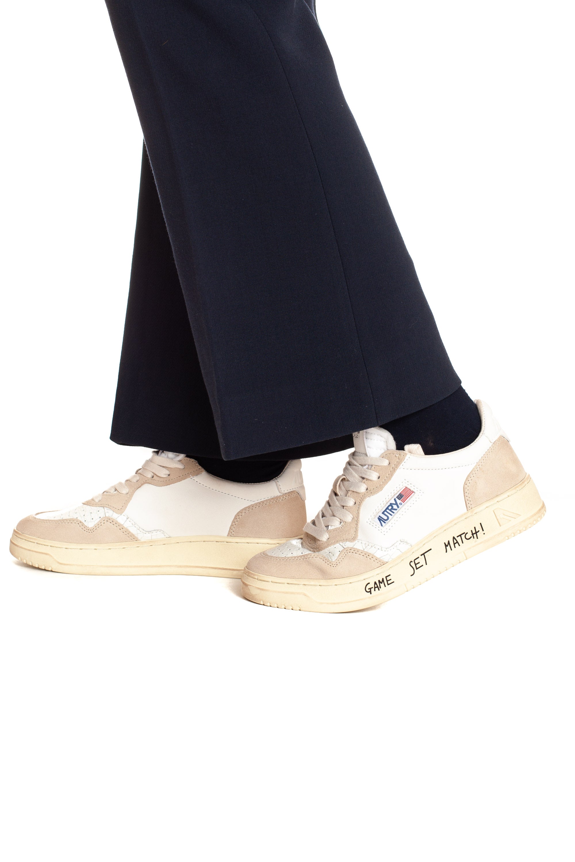 Medalist women's sneaker with white writing and heel tab