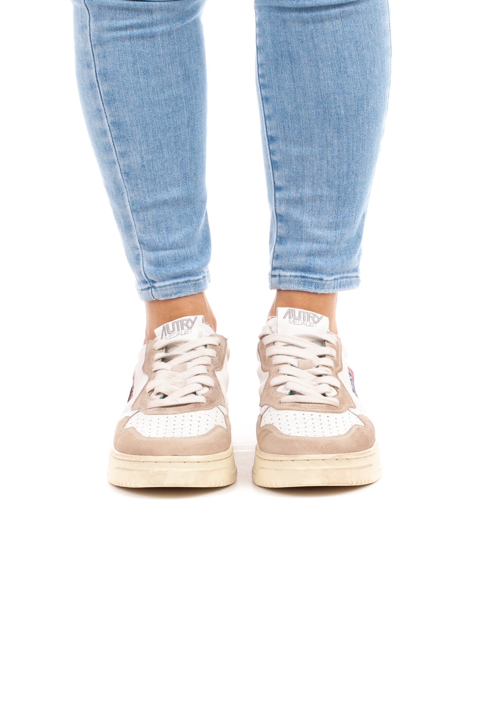 Medalist women's sneaker with green writing and heel tab