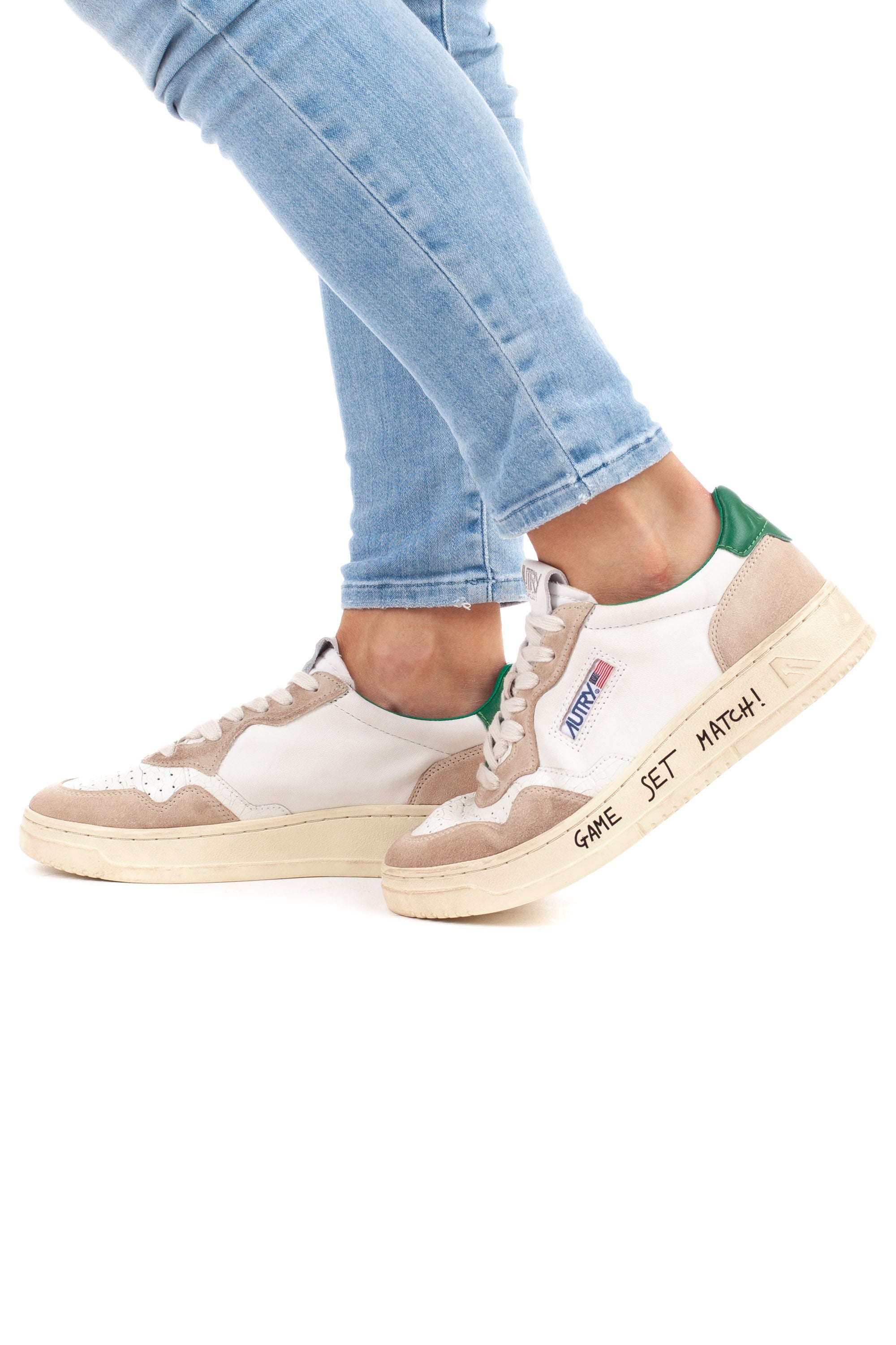 Medalist women's sneaker with green writing and heel tab