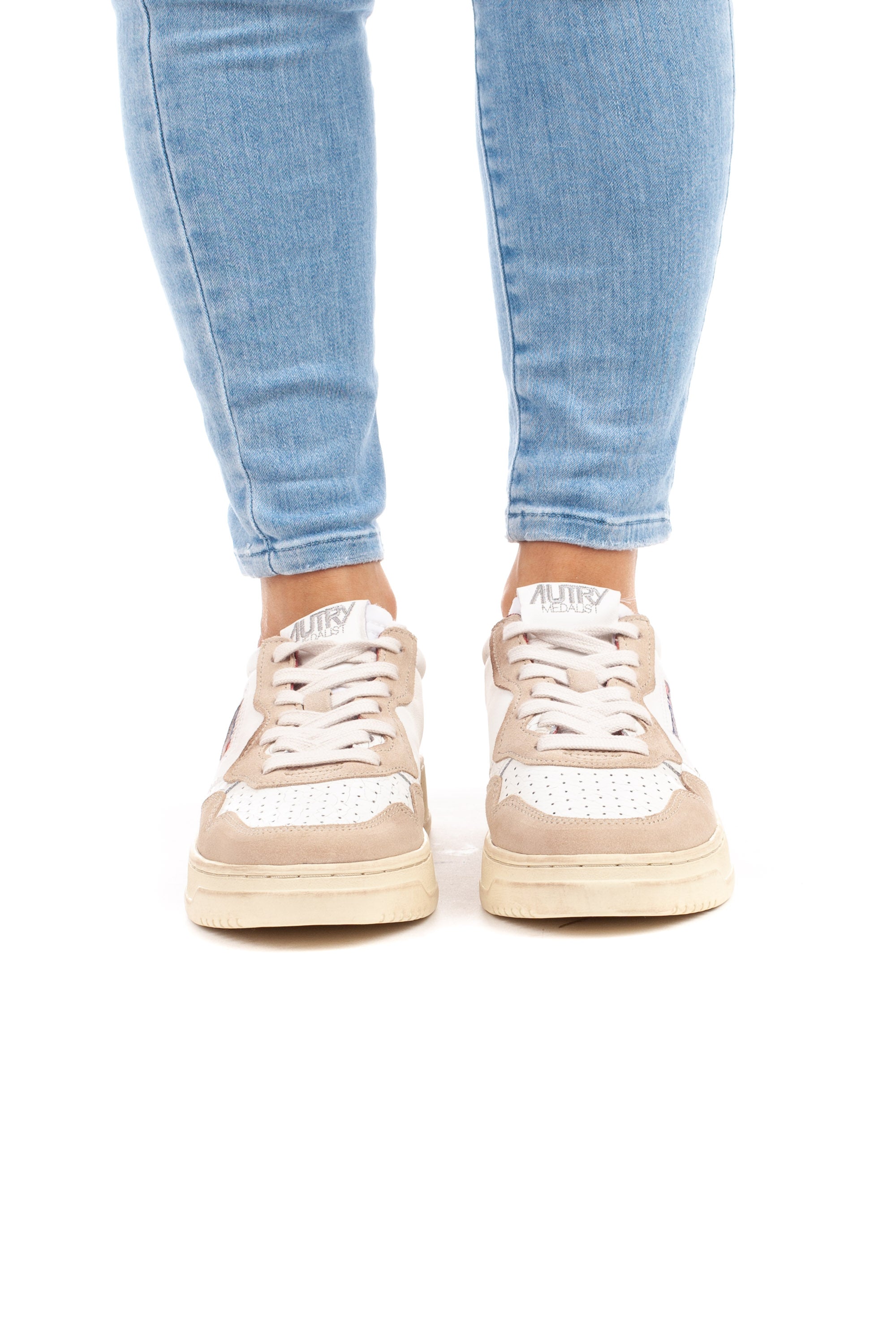 Medalist women's sneaker with red writing and heel tab