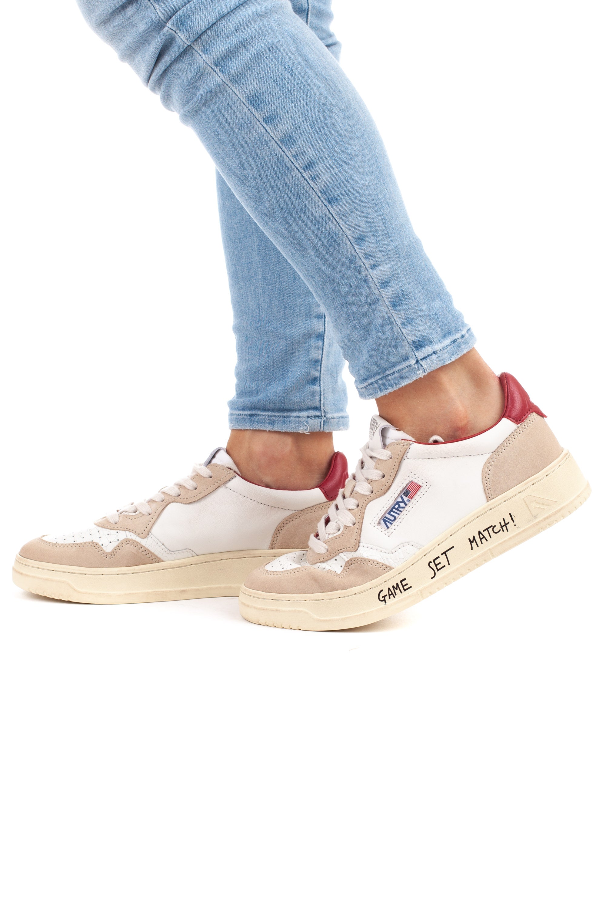 Medalist women's sneaker with red writing and heel tab