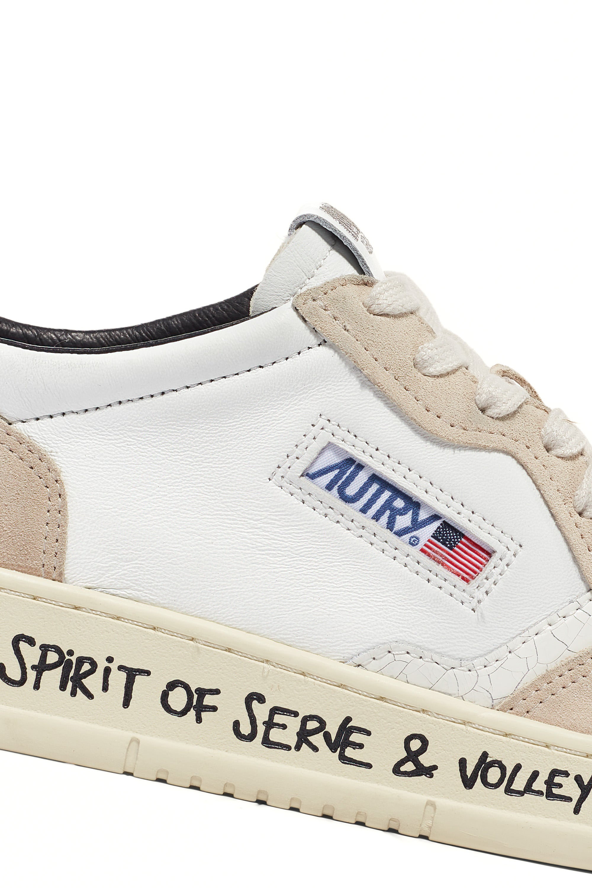 Medalist sneaker with black heel tab and writing