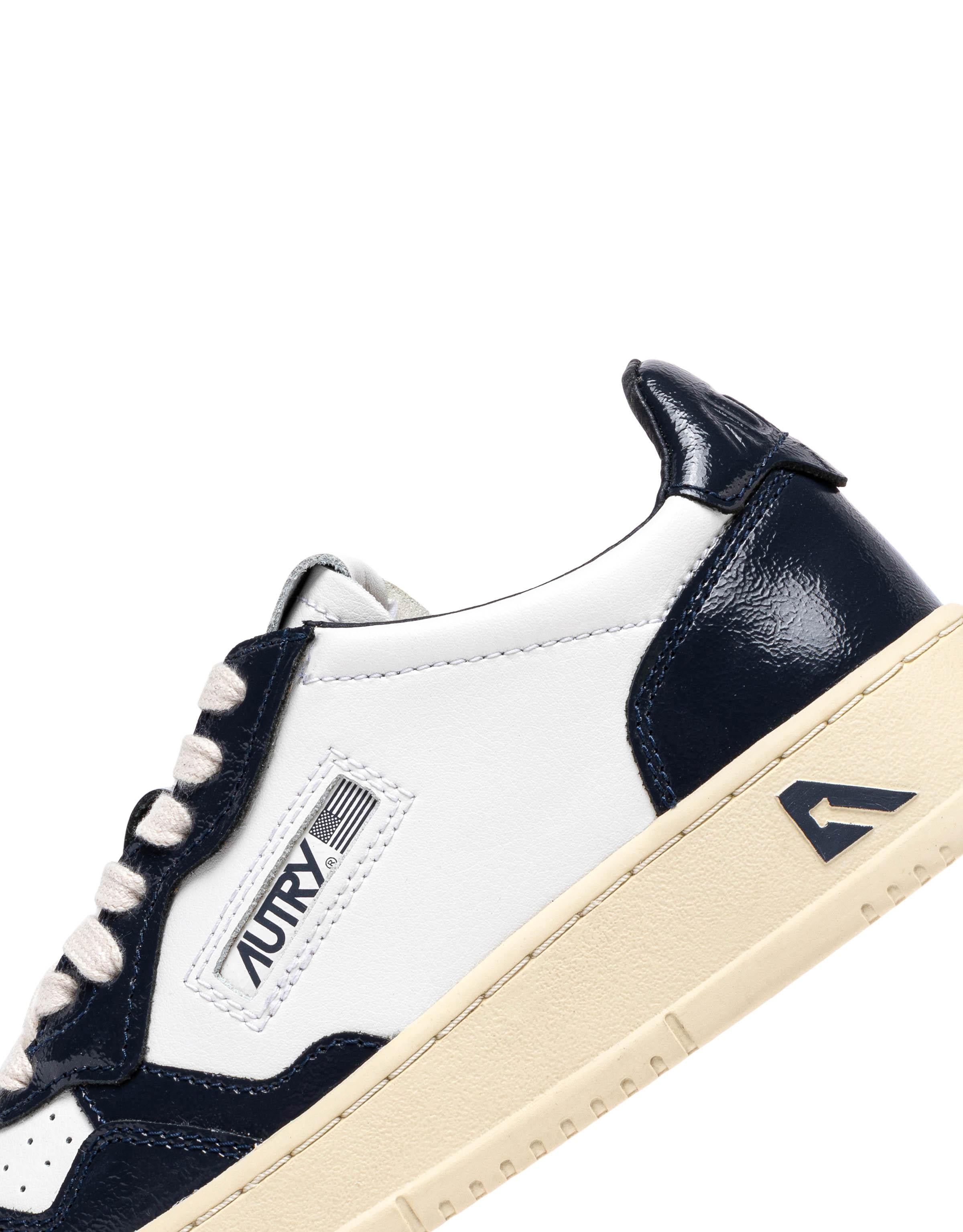 Sneaker donna bimateriale in pelle e vernice AULW RT06 WHT/NIGHT Autry 