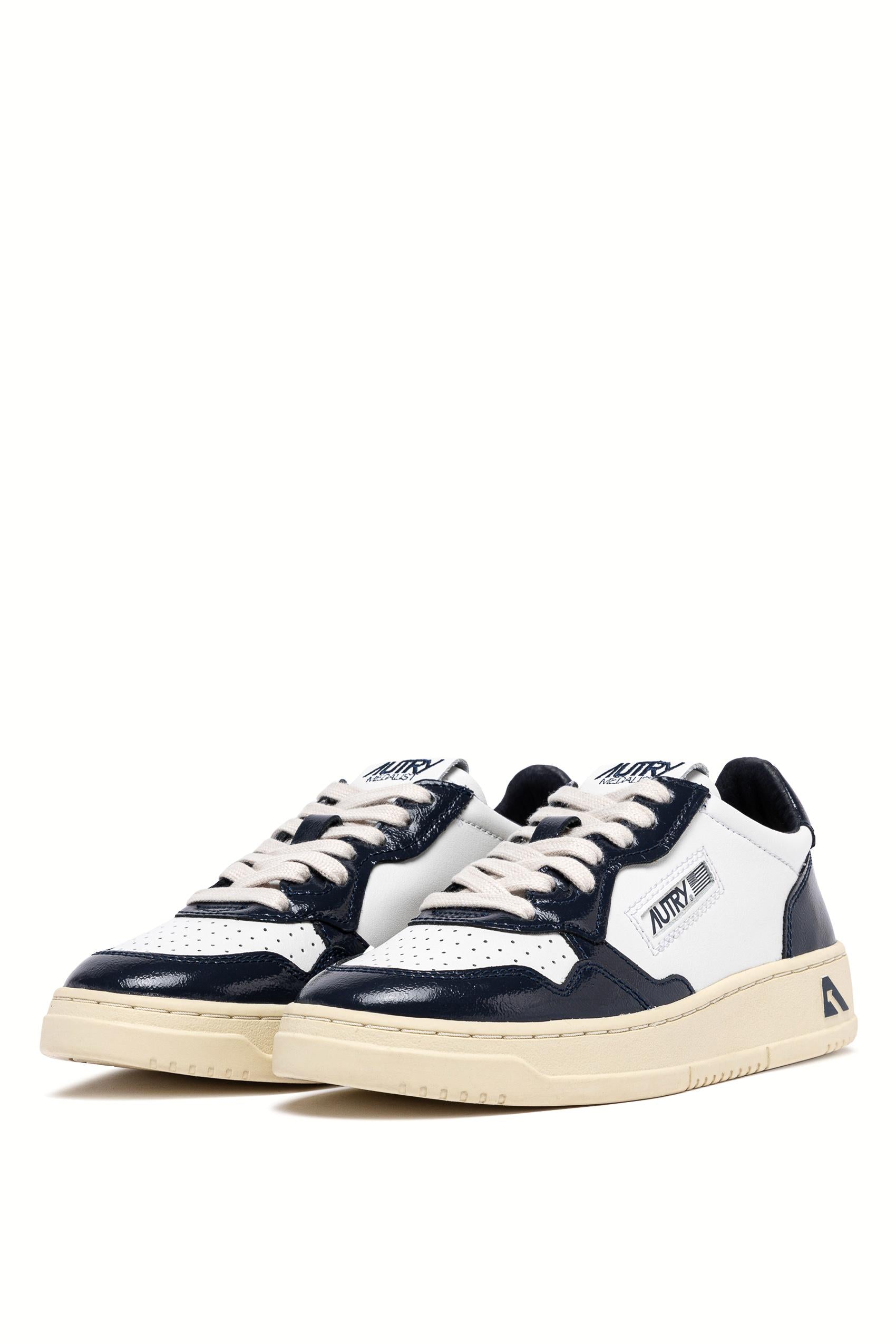Sneaker donna bimateriale in pelle e vernice AULW RT06 WHT/NIGHT Autry 